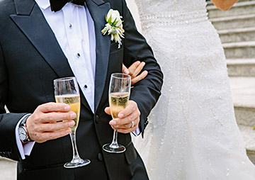 Married Couple Holding Champagne